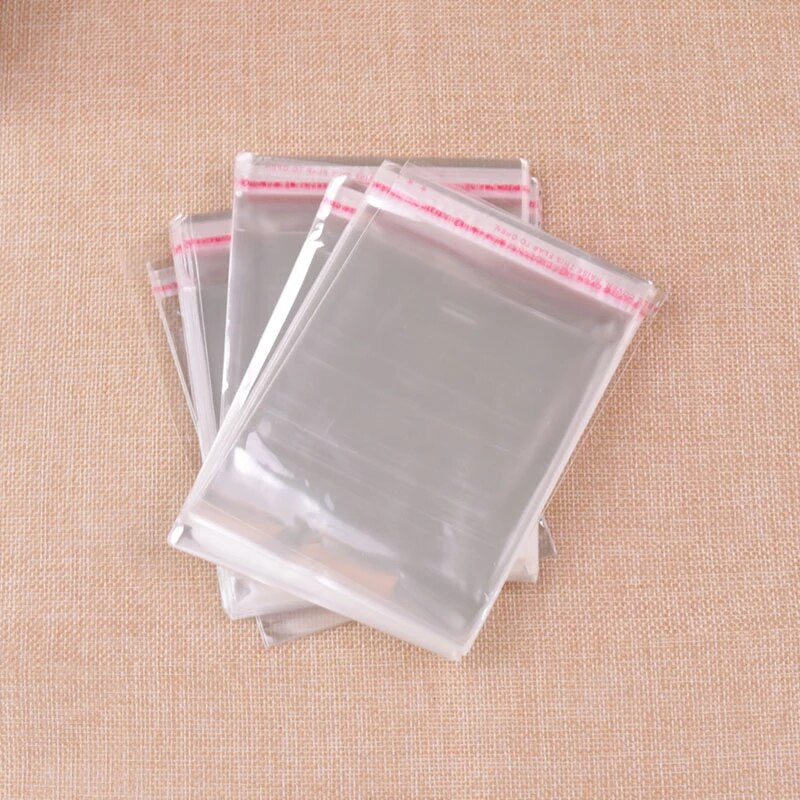 BOLSA TRANSPARENTE CON CINTA ADHESIVA, FÁCIL SELLADO